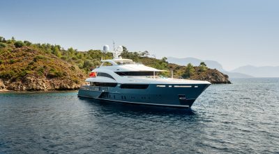 Luxury big yacht stay in the sea around the island on a background of the sky